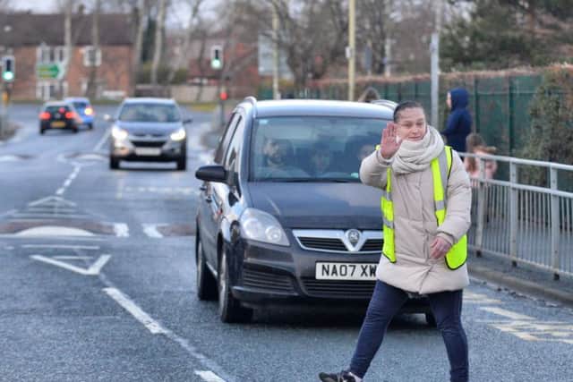 Becky Bailey acting as school crossing patrol.