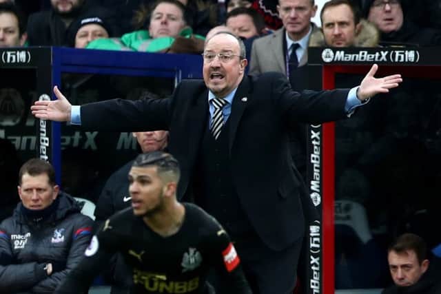 Newcastle United manager Rafael Benitez looks on with astonishment at a referee decision.