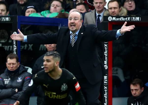 Newcastle United manager Rafael Benitez looks on with astonishment at a referee decision.