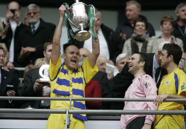 Paul Chow lifts the FA Vase in 2010.