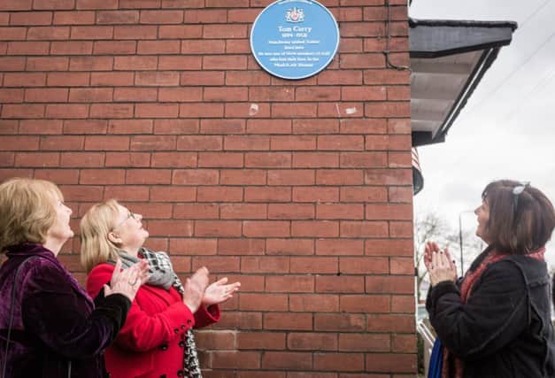 From left to right, Tom Curry's grand-daughters Jennie Dixon, Liz Esser and Jean Wilton unveil a plaque in his honour. Picture by Paul Husband.