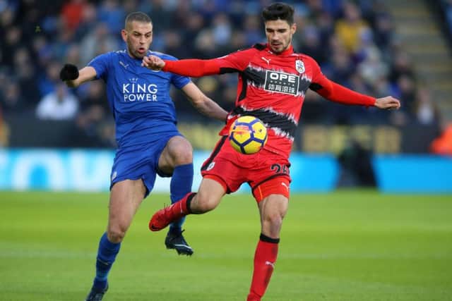 Islam Slimani, left