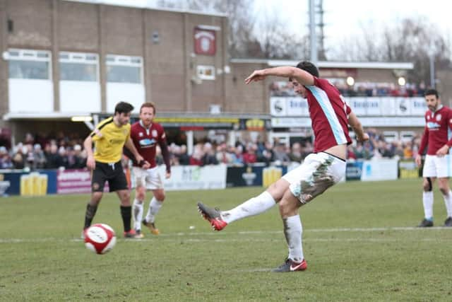 Briggs slots home from the penalty spot.