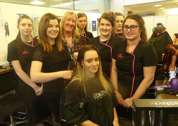 From left, Georgina Woodward, of hair product firm Redken, Samantha Hope, 16, watched by, third left, lecturer Kathryn Parkin and hair and beauty students.