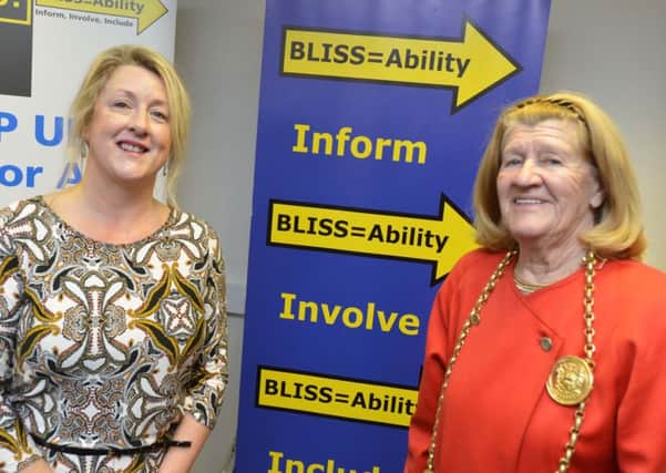 BLISS=Ability celebrate 20 years. CEO Sharon Bell and mayor Olive Punchion