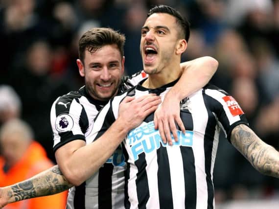 Newcastle United's Joselu (right) celebrates scoring his side's first goal of the game with team mate Paul Dummett.