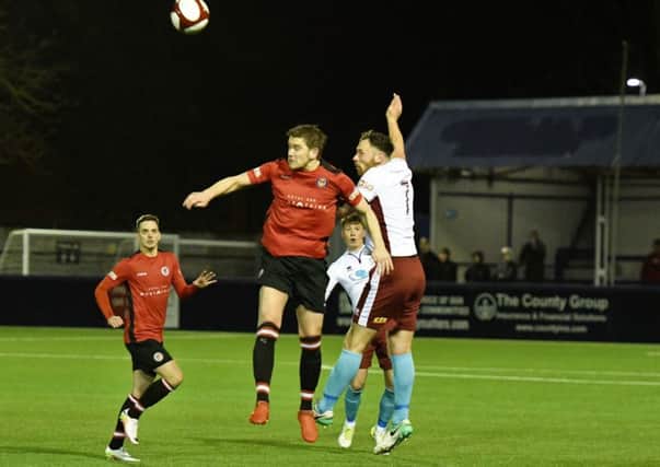 Louis Storey rises for a challenge in South Shields draw at Hyde United on Tuesday. Picture by Kev Wilson.