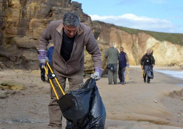 Volunteers taking part in the National Trust beach clean-up at Marsden Bay.