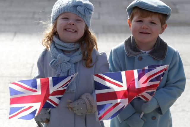 Siblings Harper (left) and Lyle Mack, both 3 and from South Shields, waiting outside the Fire Station arts centre in Sunderland ahead of a visit by the Duke and Duchess of Cambridge. PRESS ASSOCIATION Photo. Picture date: Wednesday February 21, 2018. See PA story ROYAL Cambridges. Photo credit should read: Jane Barlow/PA Wire