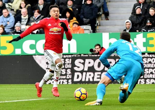 Martin Dubravka dives at the feet of Jesse Lingard in Newcastle's win over Manchester United a fortnight ago. Picture by Frank Reid