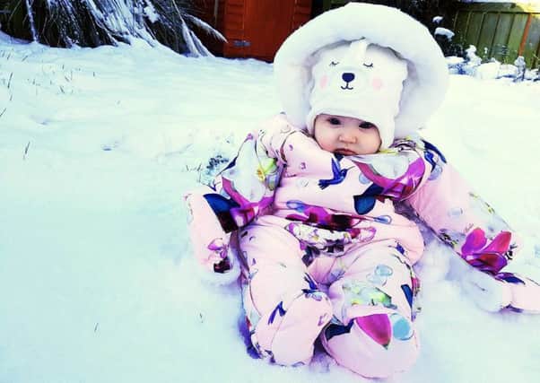 Sophie Heilbron sent us this smashing picture of baby Eden's first time in the snow. She doesn't look too sure...