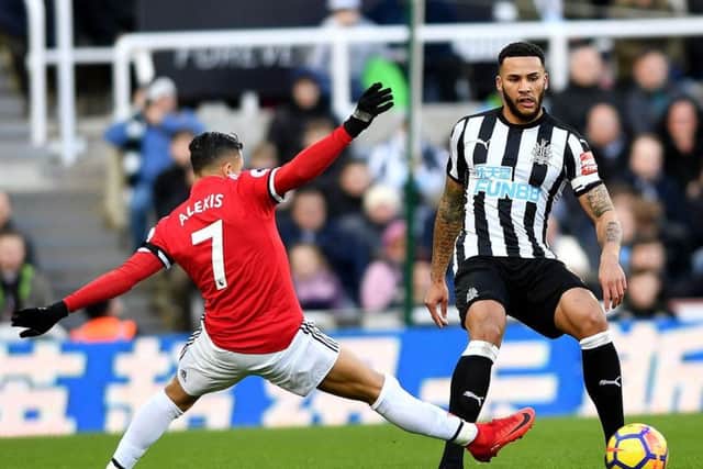 Jamaal Lascelles gets the better of Alexis Sanchez in Newcastle's recent win over Manchester United. Picture by Frank Reid