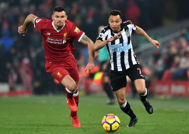 Liverpool's Dejan Lovren (left) and Newcastle United's Jacob Murphy battle for the ball.
