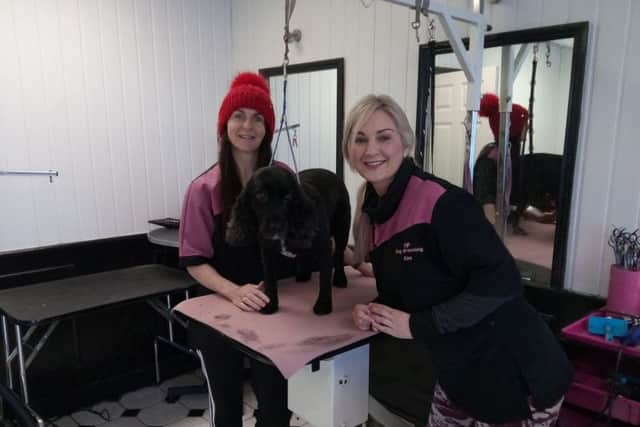 Heather Robinson and Kim Pye, of VIP Grooming, with cocker spaniel Mya.