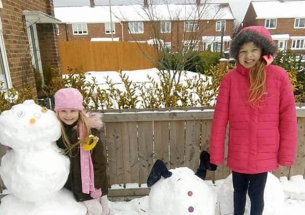 Sent in by Tracy Walker. Tilly Rose Johns and Summer Walker with their snowmen.