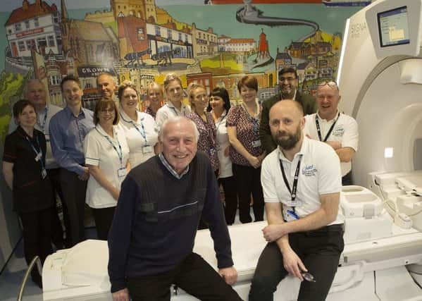 Artist Bob Olley, left,  with Miles Weston, MRI lead at South Tyneside District Hospital, and other staff.