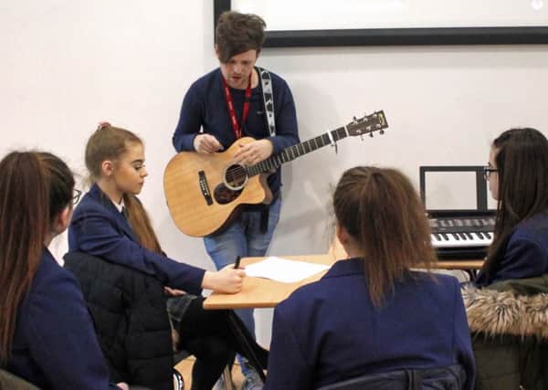 Students at South Shields School work on their song lyrics with chart topping indie-star Rich Cottell.