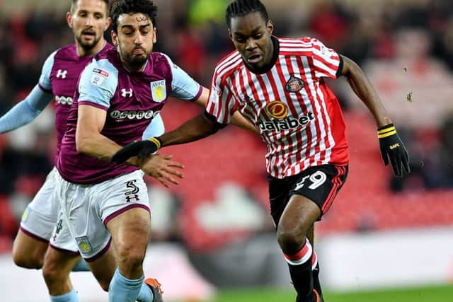 Sunderland striker Joel Asoro battles against Villa defender Neil Taylor last night. Picture by Frank Reid