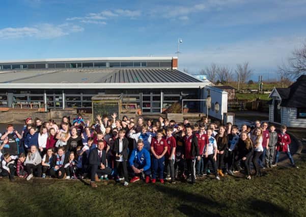 South Shields FC player Carl Finnigan, front right, and commercial director David Mitchell, front left, with pupils at Westoe Crown Primary School. Picture by Lee Hogan.