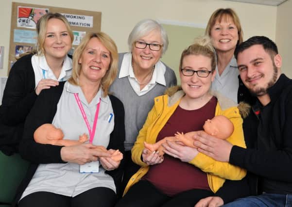 Rachel McVey and Kevin Doran (front right) with Coun Atkinson (centre) and breastfeeding support workers Jan Carmichael, Michelle Smith and student midwife Jessica Rivers.
