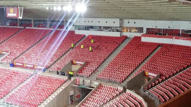Stewards inspect seating s at the Stadium of Light in the Newcastle end following their reserve-team win over Sunderland on March 7.