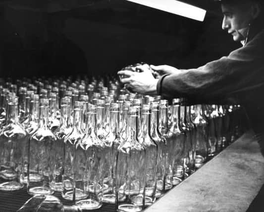 Making glass bottles.