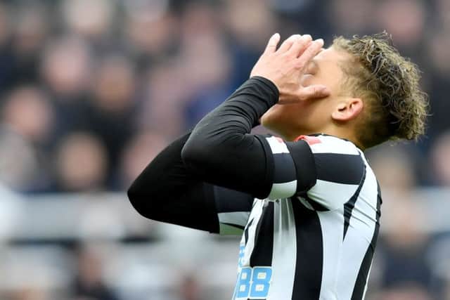 Dwight Gayle reacts after a missed chance.