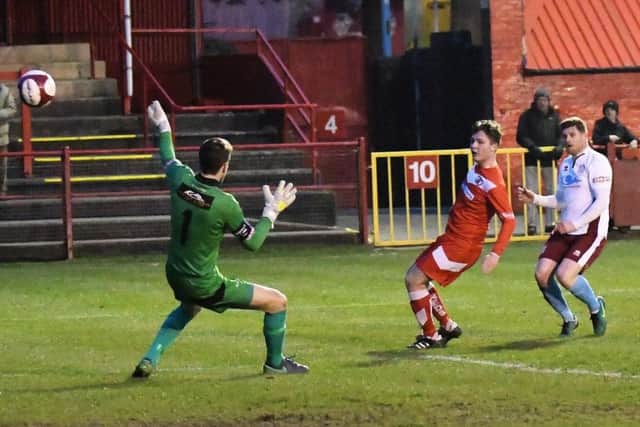 Lee Mason grabs South Shields' opener at Workington. Picture by Kevin Wilson