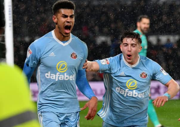Lynden Gooch (right) joins Ashley Fletcher to celebrate the on-loan striker's goal in last night's 4-1 win at Derby. Picture by Frank Reid