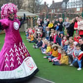 Big Pink Dress fundraiser Colin Burgin-Plews shows off his new dress for the London Marathon to pupils at Harton Village Kindergarten.