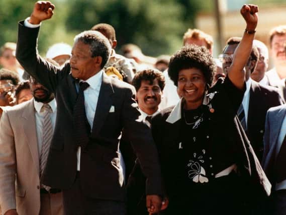 File photo dated Sunday, February 11, 1990, of Winnie with husband Nelson walking hand in hand upon his release from Victor prison, Cape Town (AP Photo)