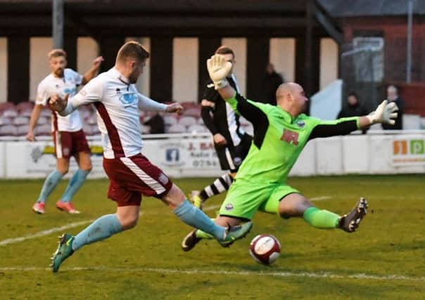 Lee Mason squeezes home Shields' first goal last night. Picture by Kevin Wilson