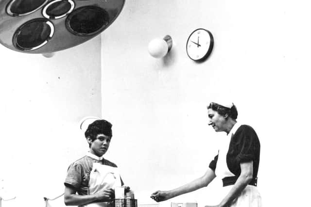 September 1970  Ingham Infirmary   
Right, Sister Sarah Cain and Nurse Margaret Maughan keeping equipment in the theatre in order.