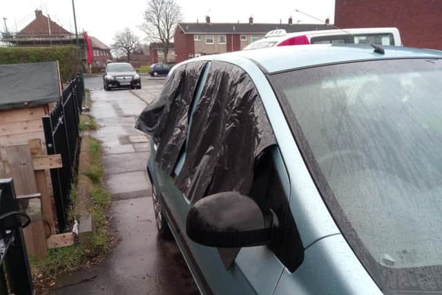 One of the cars damaged in the break ins.