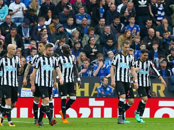 Newcastle's players celebrate the goal of Ayoze Perez, far right