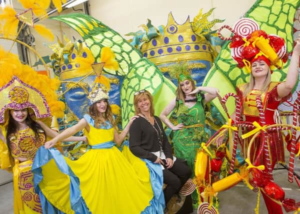 Sandy Harris with some of the amazing parade costumes made by Creative Seed