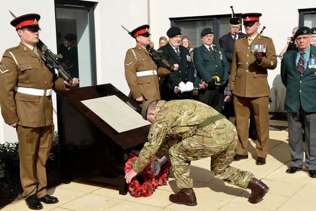 Captain Mark Armstrong from 'C' Company 4th Duke of Lancashire Regiment lays a wreath during the Service of Dedication of a Memorial to Second Lieutenant Joseph Henry Collin VC. Picture by FRANK REID