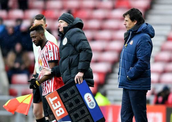 Chris Coleman looks on as Kazenga LuaLua goes onto the pitch as a sub.
