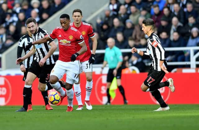 Paul Dummett battles against Anthony Martial in Newcastle's recent win over Manchester United