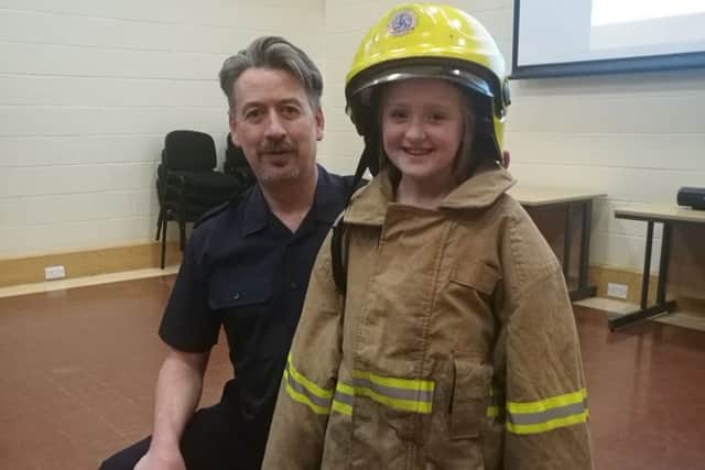 Leah Carson with firefighter Brian Lazzari