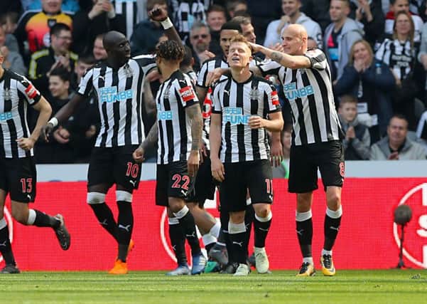 Matt Ritchie celebrates scoring Newcastle Uniteds second goal of the game with his team-mates.