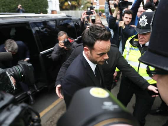 TV presenter Anthony McPartlin centre arrives at The Court House in Wimbledon, London, to face charges of drink driving. Pic: PA.