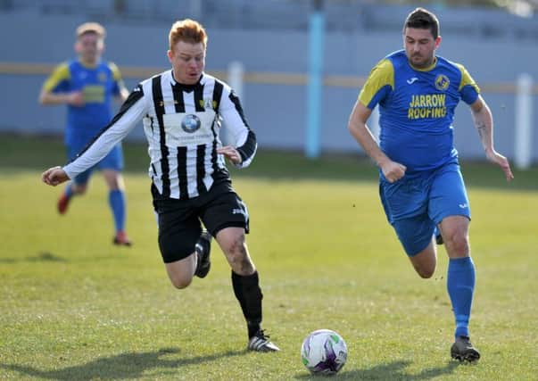 Jarrow Roofing (blue) attack in their recent clash with Ashington