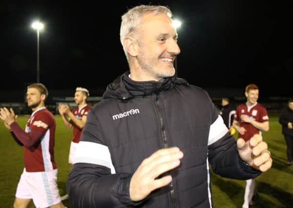 Lee Picton celebrates Shields' promotion-clinching win over Glossop North End. Picture by Peter Talbot.