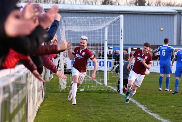 Striker Carl Finnigan celebrates opening the scoring in South Shields' promotion-clinching win over Glossop North End on Tuesday. Picture by Kev Wilson.