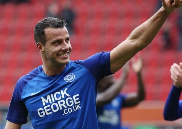 Steven Taylor, of Peterborough United, gives the thumbs up.