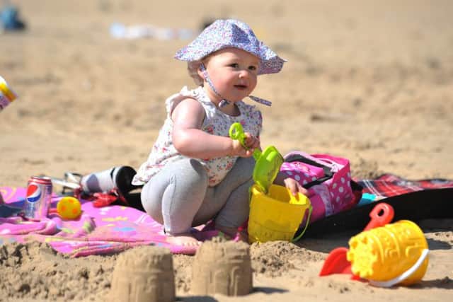 Daisy Turner making sandcastles on Sandhaven Beach in South Shields.