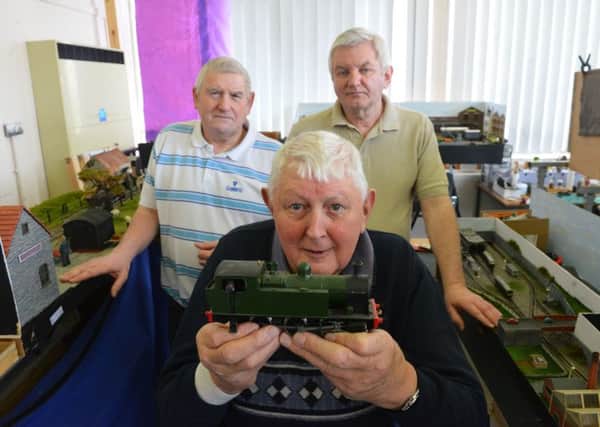 The Model Railway Men at Chuter Ede CC are to hold a open day exhibition. From left Richard Andrews and Colin Salmons with Chris Staniland (front)