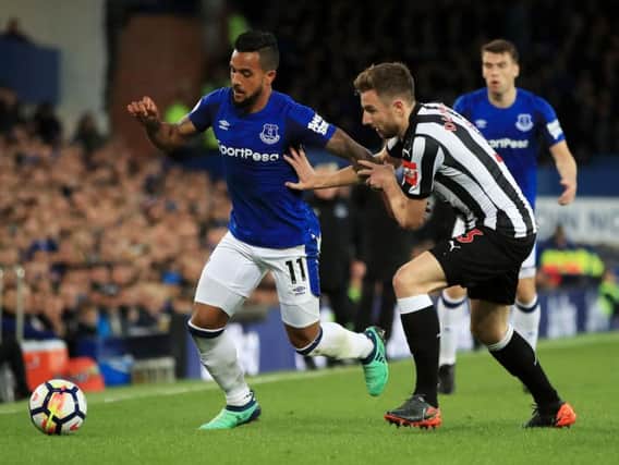 Theo Walcott and Paul Dummett