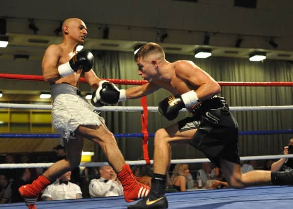 Sam Menzies (black shorts) goes on the offensive against Anwar Alfadi at Temple Park, South Shields on Saturday night.